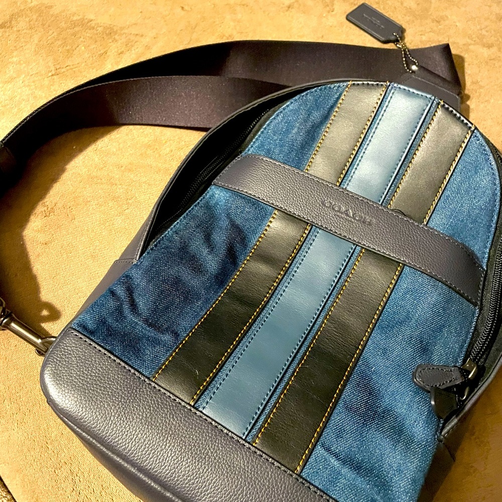 Coach denim/leather backpack w/one strap.  Unisex.